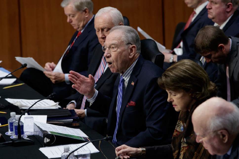 Senate Judiciary Committee Chairman Sen. Charles Grassley, R-Iowa, center, emphatically defends the nomination of President Donald Trump's Supreme Court nominee Neil Gorsuch to fill the vacancy left by the late Antonin Scalia, Monday, April 3, 2017, on Capitol Hill in Washington. From left are Sen. Lindsey Graham, R-S.C., Sen. Orrin Hatch, R-Utah, Grassley, ranking member Sen. Dianne Feinstein, D-Calif. and Sen. Patrick Leahy, D-Vt. (AP Photo/J. Scott Applewhite) ,