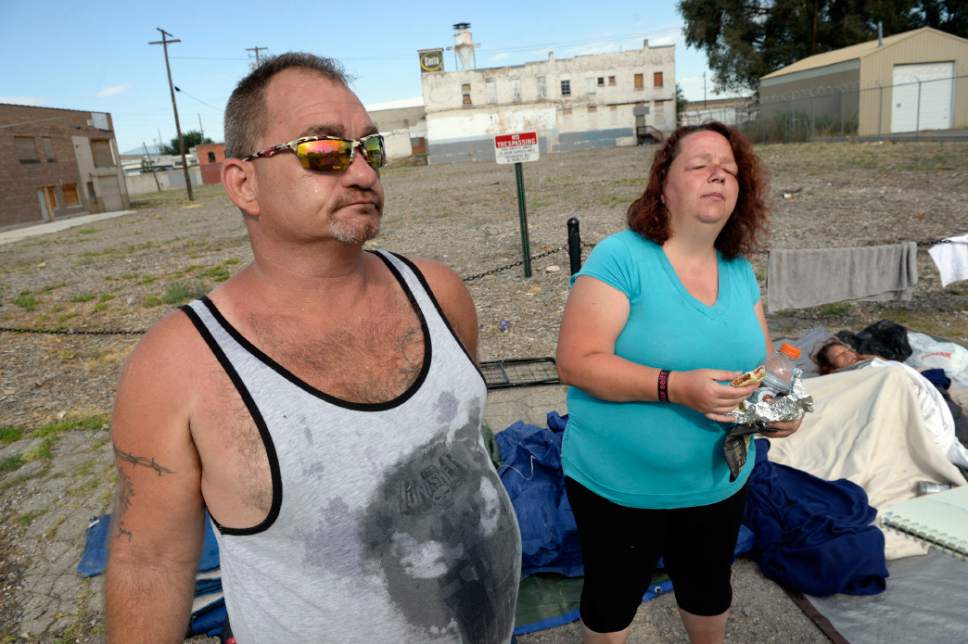 Al Hartmann  |  The Salt Lake Tribune
Lynn Jordan and friend "Marge" have been camping out on a strip of ground between the city sidewalk and a field marked "No tresspassing" at about 500 W. and 350 S.  He is among a new group of homeless who are camping out on the 500 West Commons just west of the Rio Grande Depot and a block or two south of the shelter.