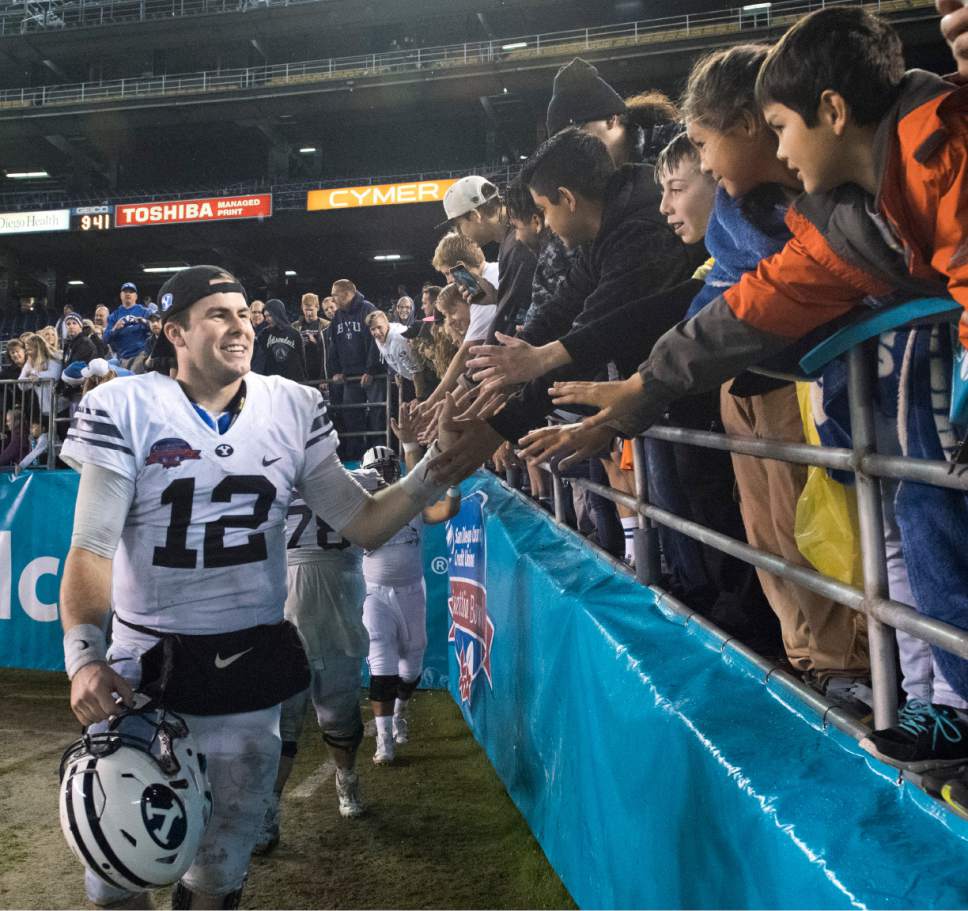 Rick Egan  |  The Salt Lake Tribune

Brigham Young Cougars quarterback Tanner Mangum (12) greets fans after BYU defeated Wyoming 24-21in the Poinsettia Bowl, at Qualcomm Stadium in San Diego, December 21, 2016.