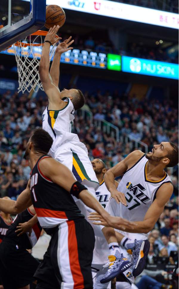 Steve Griffin  |  The Salt Lake Tribune


Utah Jazz guard Dante Exum (11) stretches for the basket as the ball squirts away from him during the Utah Jazz versus Portland Trailblazers NBA basketball game at Vivint Smart Home Arena in Salt Lake City Tuesday April 4, 2017.