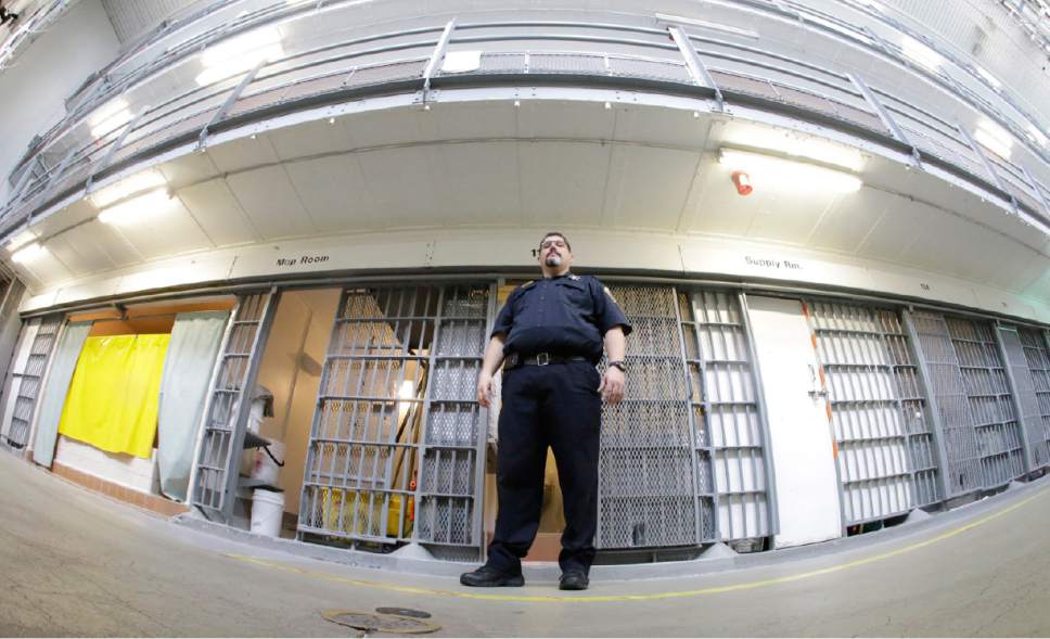 Warden Scott Crowther stands in front of cells in Wasatch A-East block during a media tour Thursday, Feb. 26, 2015, at the Utah State Correctional Facility in Draper. (AP Photo/Rick Bowmer, Pool)