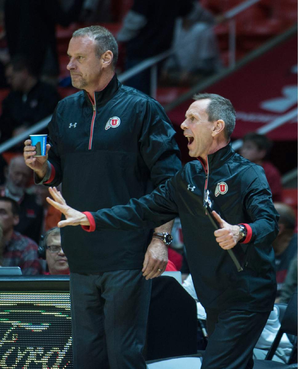 Lennie Mahler  |  The Salt Lake Tribune

Utah head coach Larry Krystkowiak and assistant coach Tommy Connor motion to players during a game between Utah and Washington State at the Huntsman Center in Salt Lake City, Thursday, Feb. 9, 2017.