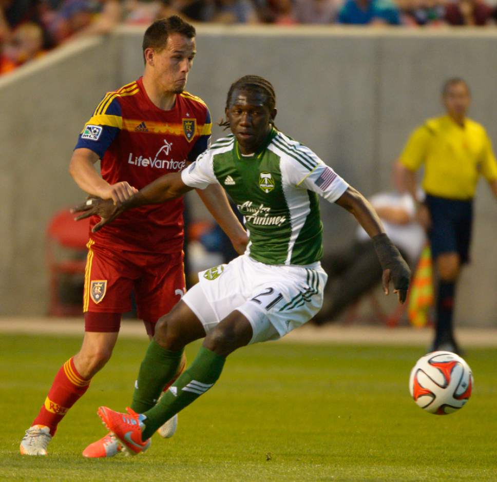 Rick Egan  |  The Salt Lake Tribune

Real Salt Lake midfielder Luis Gil (21) defends, as Portland Timbers midfielder Diego Chara (21) goes for the ball, in MLS soccer action at Rio Tinto stadium, Saturday, June 7, 2014