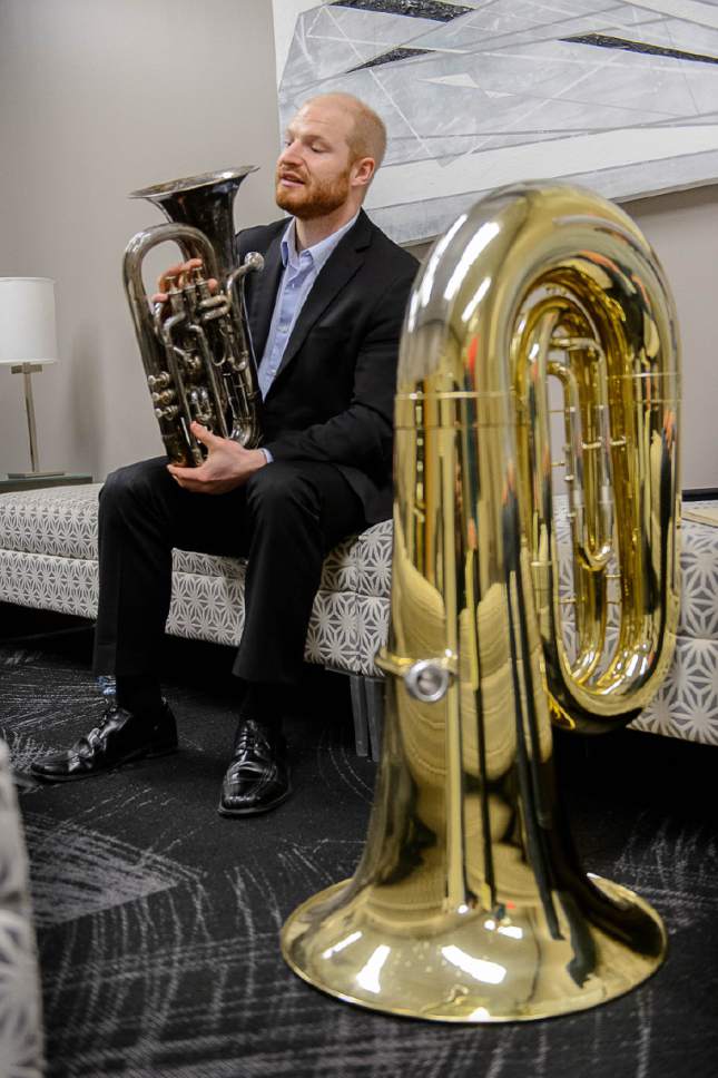 Trent Nelson  |  The Salt Lake Tribune
Mark Davidson holds a famous French tuba acquired by Utah Symphony tuba player Gary Ofenloch in Salt Lake City, Tuesday March 14, 2017. The tuba is the very instrument on which the "ox-cart" solo in "Pictures at an Exhibition" was first played. Davidson will play the solo on this famous instrument for the Utah Symphony on April 7 and 8.