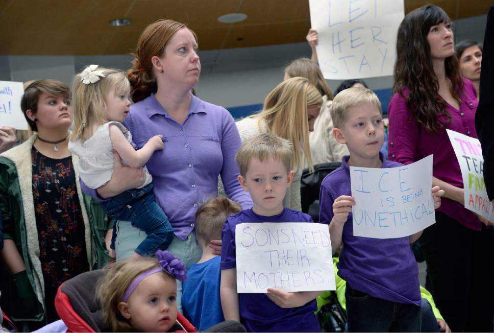 Al Hartmann  |  The Salt Lake Tribune
Mormon women and other concerned citizens gather at the Salt Lake City Airport in a show of solidarity for an area woman, Isabel, who has been ordered to leave the United States by ICE agents. 
ICE  escorted her onto a flight bound for Colombia. Isabel is a single mother and is the sole caretaker for her disabled son and her 86-year-old mother.