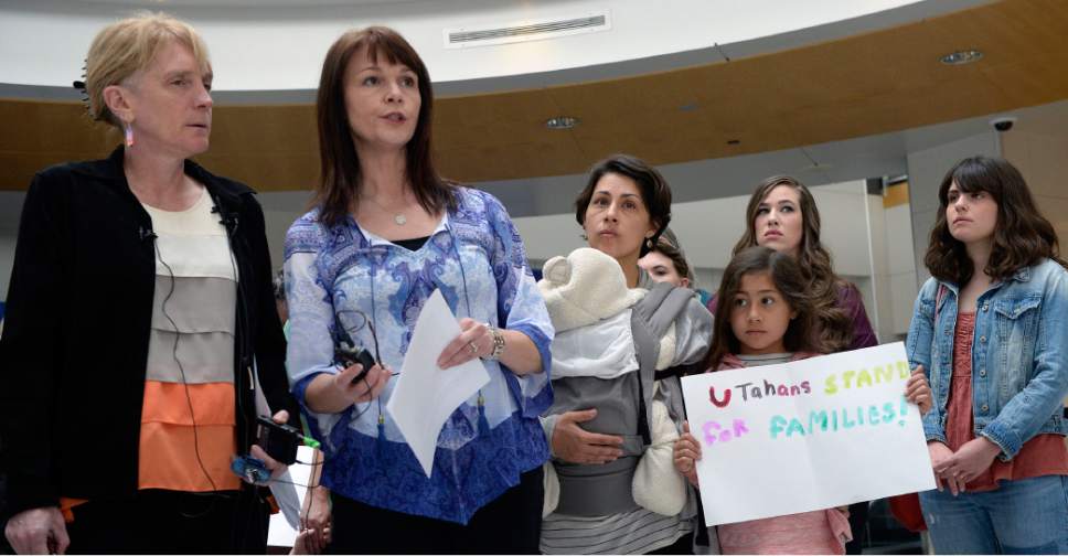 Al Hartmann  |  The Salt Lake Tribune
Judi Hilman with Salt Lake Indivisible, left, and Sharlee Glenn with Mormon Women for Ethical Government gathered with Mormon women and other concerned citizens at the Salt Lake City Airport in a show of solidarity for an area woman, Isabel, who has been ordered to leave the United States by ICE agents. 
ICE  escorted her onto a flight bound for Colombia. Isabel is a single mother and is the sole caretaker for her disabled son and her 86-year-old mother.