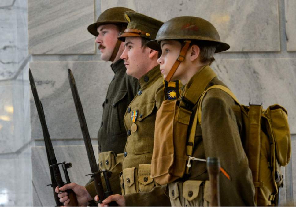Steve Griffin  |  The Salt Lake Tribune


Dressed in a replica WWI military uniform, Benjamin Johnson, Aaron Bjelka and Ian Herbert, of the Fort Douglas Military Museum, stand at attention in the Capitol Rotunda as the Department of Veterans & Military Affairs and the Utah Division of State History, hold a commemoration ceremony ìRemembering the Great War.î in remembrance of the 100-year anniversary of the United States entering the first world war, famously known as The Great War. Thursday, April 6, 2017.