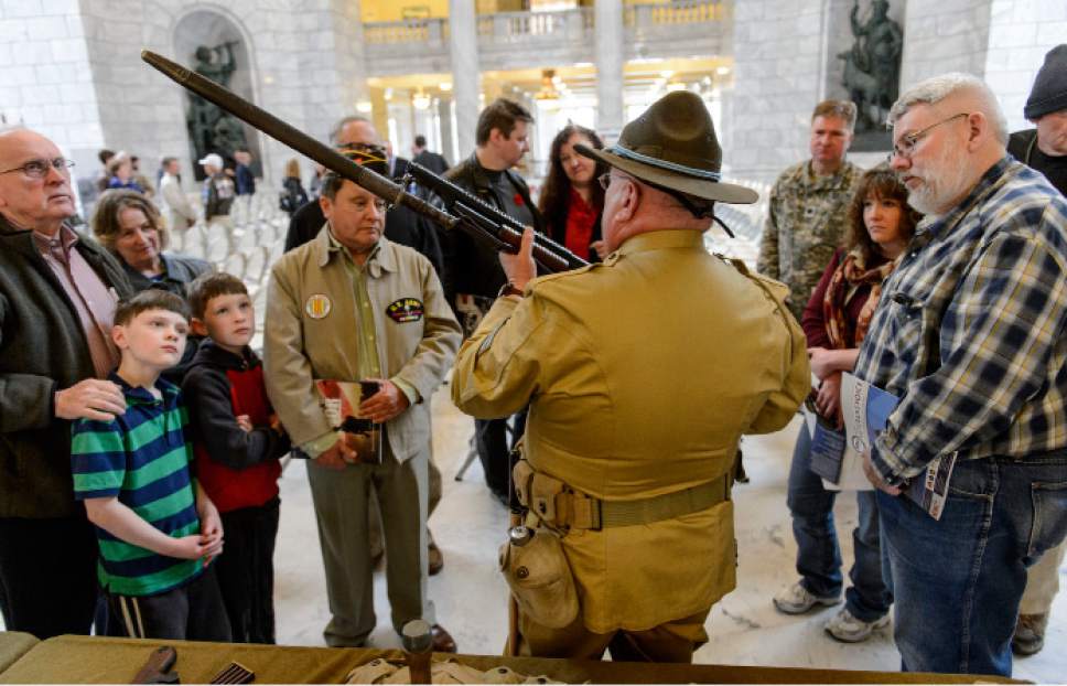 Steve Griffin  |  The Salt Lake Tribune


Dressed in a replica WWI military uniform, Chip Guarente of the Fort Douglas Military Museum, shows visitors a M1897 Winchester 12-gage shotgun, in the Capitol Rotunda as the Department of Veterans & Military Affairs and the Utah Division of State History, hold a commemoration ceremony "Remembering the Great War." in remembrance of the 100-year anniversary of the United States entering the first world war, famously known as The Great War. Thursday, April 6, 2017.