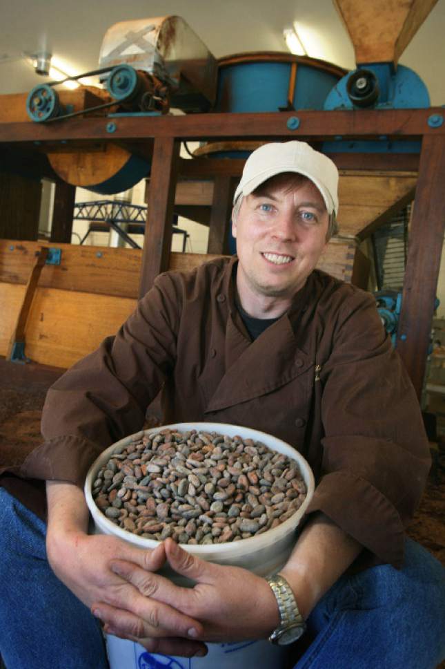 Scott Sommerdorf  |  The Salt Lake Tribune

Art Pollard poses with some of the Venzuelan cocoa beans he uses in his company - Amano Artisan Chocolate in front of an old seperating machine made in Portugal. Pollard, a BYU physics major, has dabbled in chocolate making for several years. But two years ago he started selling his creations retail. He has received several national awards.