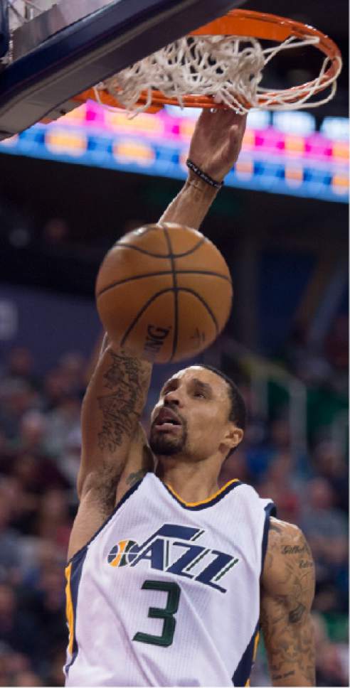 Steve Griffin / The Salt Lake Tribune

Utah Jazz guard George Hill (3) dunks the ball during the Utah Jazz versus Cleveland Cavaliers NBA basketball game at Vivint Smart Home Arena in Salt Lake City Tuesday January 10, 2017.