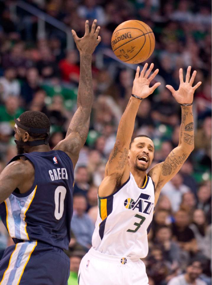 Lennie Mahler  |  The Salt Lake Tribune

George Hill loses control of the ball to JaMychal Green in a game against the Memphis Grizzlies on Saturday, Jan. 28, 2017, at Vivint Smart Home Arena in Salt Lake City.