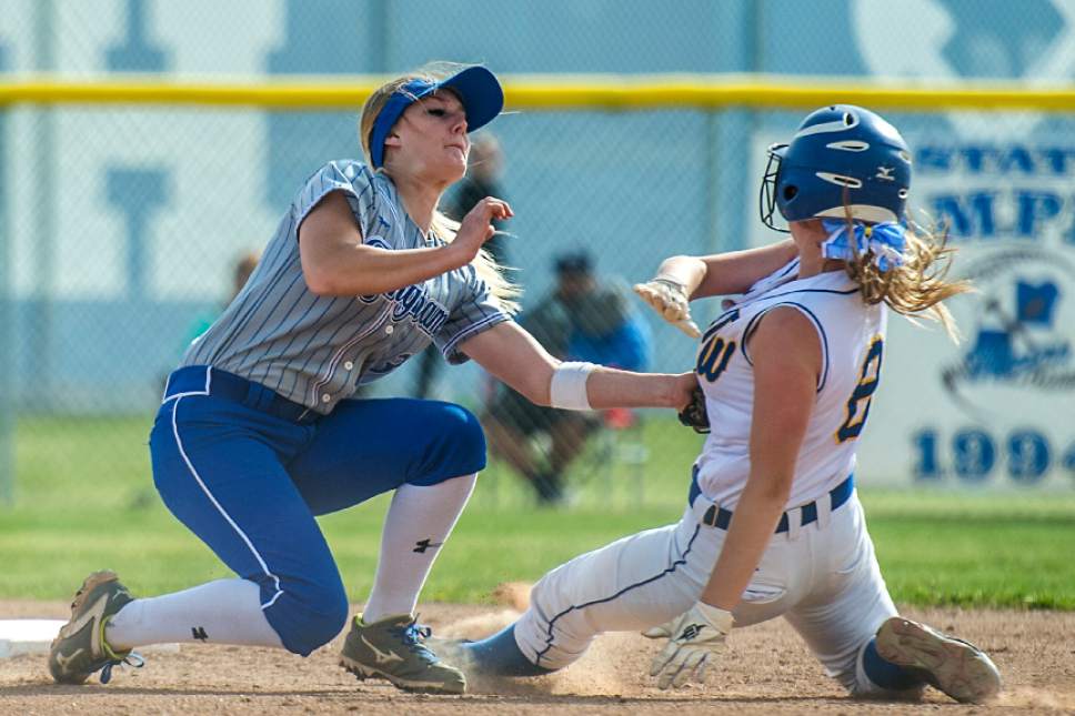 Chris Detrick  |  The Salt Lake Tribune
Bingham's McKenzie Dorney (3) tags out Taylorsville's Maziy Burbank (8) at second base during the game at Bingham High School Thursday, April 6, 2017.