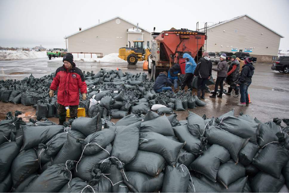Lennie Mahler  |  The Salt Lake Tribune

Volunteers fill bags with sand to block flooding in Garden City, Utah, Friday, Feb. 10, 2017.