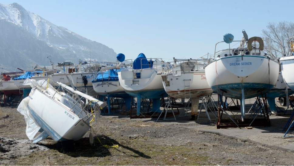Al Hartmann  |  The Salt Lake Tribune
Signs of the Great Salt Lake's low water level is evident at the Great Salt Lake Marina State Park Thursday Feb 25, 2016.  Sailboats were lifted by crane from the harbor and placed in the parking lot last Spring where they remain today. The sailboat harbor is empty with signs warning of low water levels and to launch at your own risk.  The lake has been steadily falling since 2012.  It doesn't look good for boats to hit the water this year.