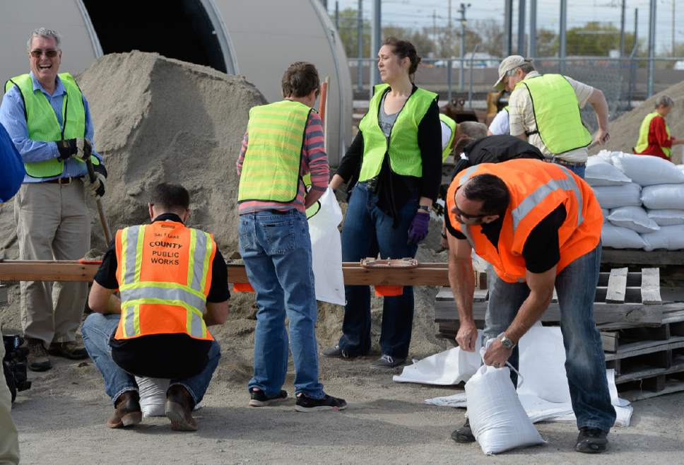 Francisco Kjolseth | The Salt Lake Tribune
Volunteers help fill sandbags in anticipation of spring snowmelt at the Salt Lake County public works building in Midvale on Thursday, April 6, 2017.