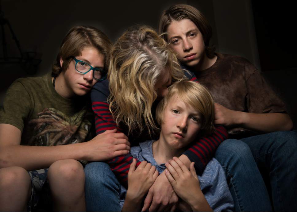 Leah Hogsten  |  The Salt Lake Tribune
Jennifer, center, who asked to be identified by only her first name, said she was sexually assaulted while attending Brigham Young University more than 20 years ago. She and her husband have taught their three sons -- pictured here in May -- about healthy sexual behavior and boundaries.