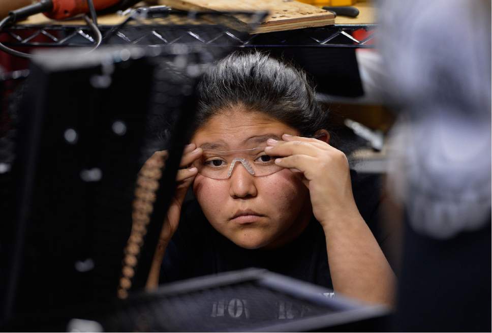 Scott Sommerdorf | The Salt Lake Tribune
Breanna Bitsinnie adjusts the safety glasses that must be work at all times as she waits for some tools to arrive, so the team can work on the robot. The Navajo Mountain High School robotics team competes at the "Utah FIRST Robotics Competition," Thursday, March 9, 2017.