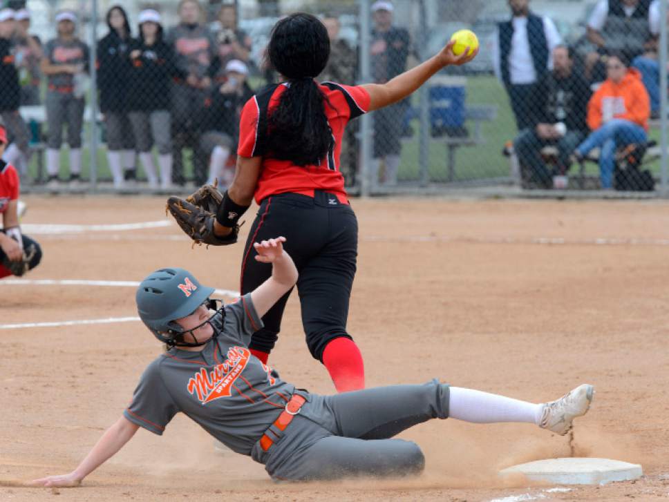 Steve Griffin  |  The Salt Lake Tribune
West third baseman Daisy Taloa fires to first after forcing out Murray's Preslee Jensen during the West versus Murray softball game at West High School in Salt Lake City, Friday, April 7, 2017.