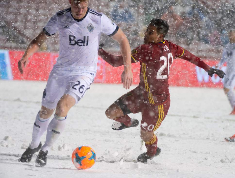 Rick Egan  |  The Salt Lake Tribune

Real Salt Lake midfielder Luis Silva (20) tries to stay on his feet, as he goes after the ball along with Vancouver Whitecaps defender Tim Parker (26) in MLS action, Real Salt Lake vs. Vancouver Whitecaps, at Rio Tinto Stadium, Saturday, April 8, 2017.