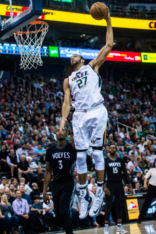 Chris Detrick  |  The Salt Lake Tribune
Utah Jazz center Rudy Gobert (27) dunks past Minnesota Timberwolves guard Kris Dunn (3) during the game at Vivint Smart Home Arena Friday, April 7, 2017.