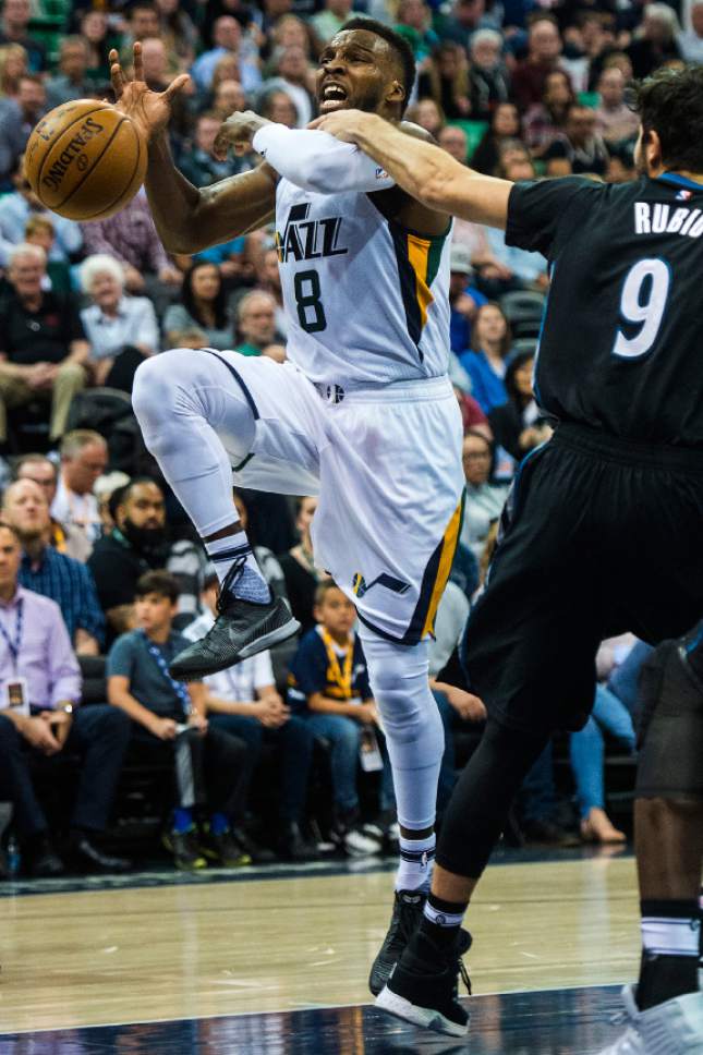 Chris Detrick  |  The Salt Lake Tribune
Minnesota Timberwolves guard Ricky Rubio (9) fouls Utah Jazz guard Shelvin Mack (8) during the game at Vivint Smart Home Arena Friday, April 7, 2017.