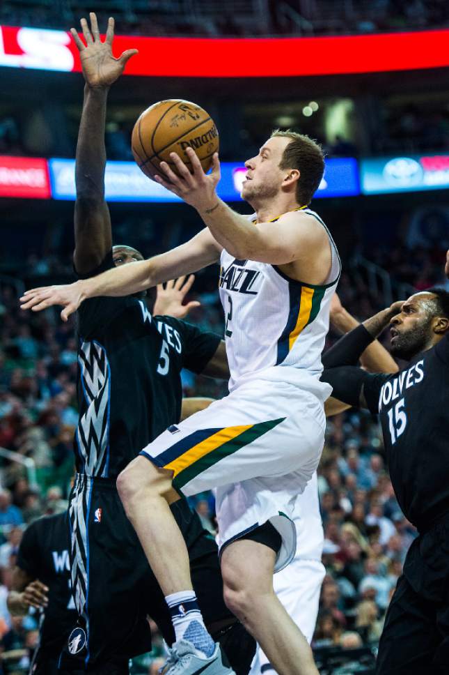 Chris Detrick  |  The Salt Lake Tribune
Utah Jazz forward Joe Ingles (2) shoots past Minnesota Timberwolves forward Gorgui Dieng (5) and Minnesota Timberwolves forward Shabazz Muhammad (15) during the game at Vivint Smart Home Arena Friday, April 7, 2017.