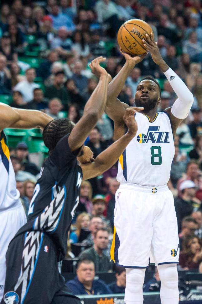 Chris Detrick  |  The Salt Lake Tribune
Utah Jazz guard Shelvin Mack (8) shoots past Minnesota Timberwolves forward Andrew Wiggins (22) during the game at Vivint Smart Home Arena Friday, April 7, 2017.