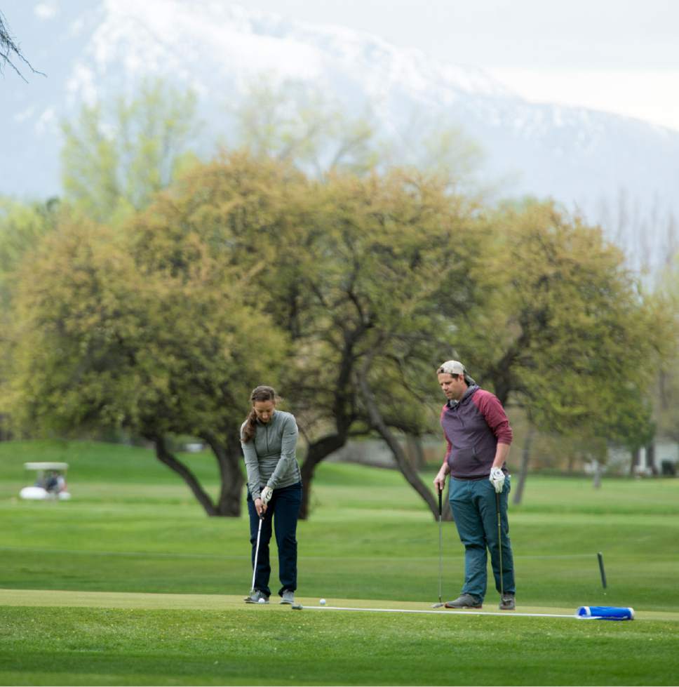 Rick Egan  |  The Salt Lake Tribune

Rebecca Hartman and Jason Christensen, play a round of golf at Nibley Park Golf Course, Friday, April 7, 2017.