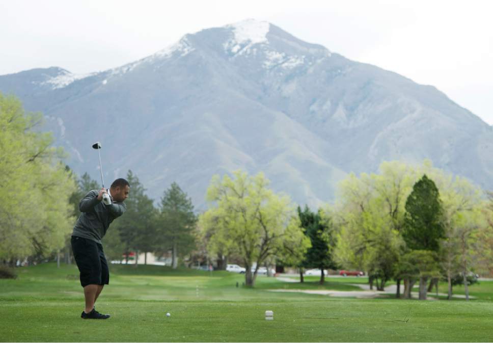 Rick Egan  |  The Salt Lake Tribune
Stephen Selu hits a drive at Nibley Park Golf Course on Friday.