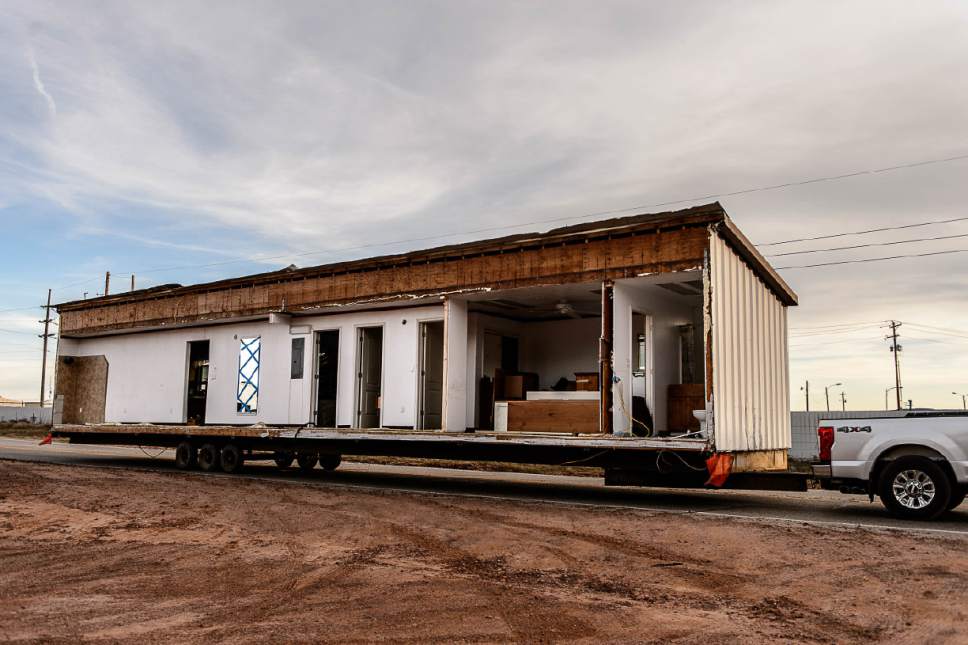 Trent Nelson  |  The Salt Lake Tribune
A group of FLDS members move a modular home from a lot in Hildale as part of an eviction from UEP trust property, Wednesday April 5, 2017. Many FLDS members have refused to cooperate with the state-controlled land trust and are now facing eviction.