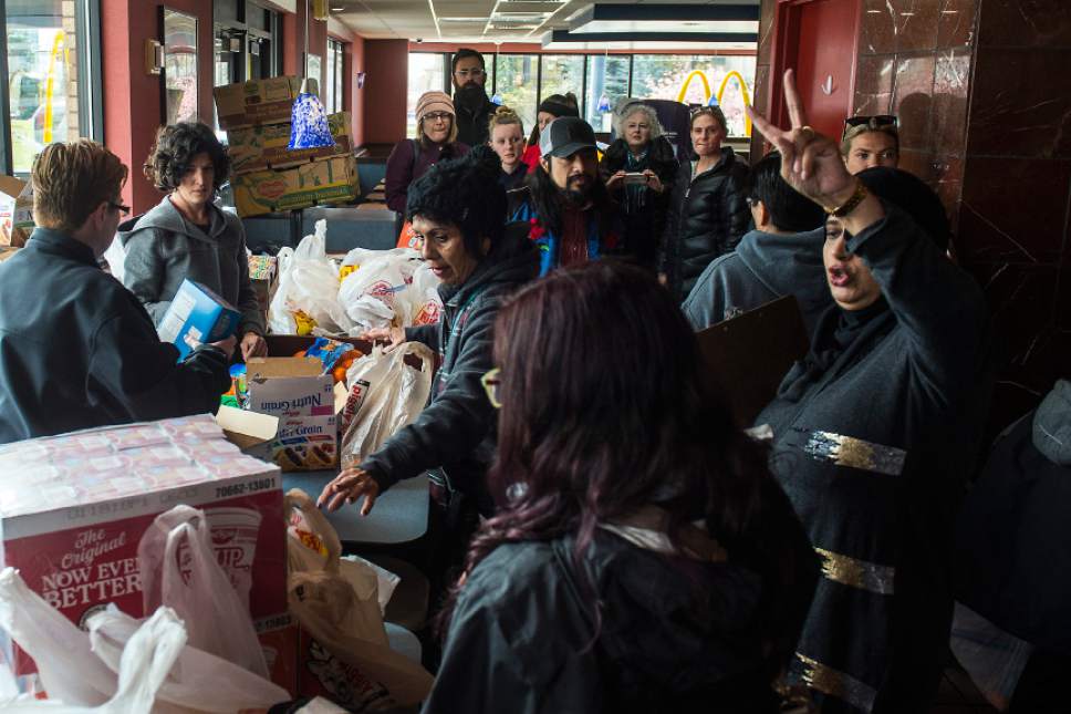 Chris Detrick  |  The Salt Lake Tribune
Noor Ul-Hasan, right, helps to organize volunteers at McDonalds in Salt Lake City Sunday, April 9, 2017.  Over thirty volunteers helped hand out 300 meals to homeless people around Pioneer Park and the Road Home.