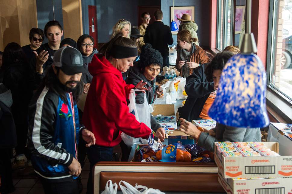 Chris Detrick  |  The Salt Lake Tribune
Volunteers organize food to be distributed to homeless individuals at McDonalds in Salt Lake City Sunday, April 9, 2017.  Over thirty volunteers helped hand out 300 meals to homeless people around Pioneer Park and the Road Home.
