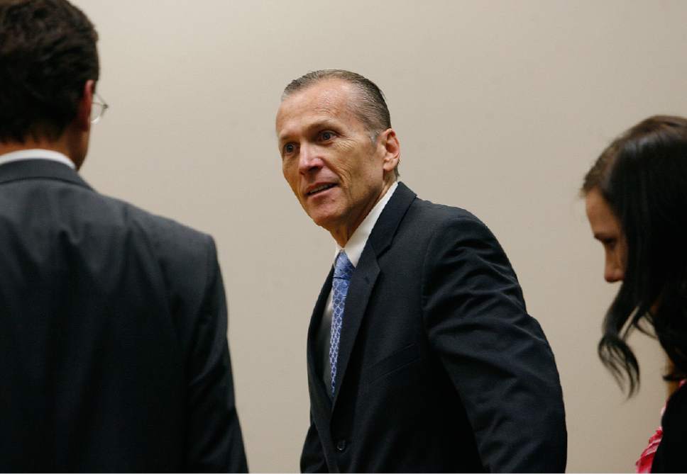 Scott Sommerdorf   |  The Salt Lake Tribune

Martin MacNeill greets his defense team as he enters the courtroom after the jury reached a verdict. MacNeill was found guilty of murder and obstruction of justice early Saturday morning, November 9, 2013.