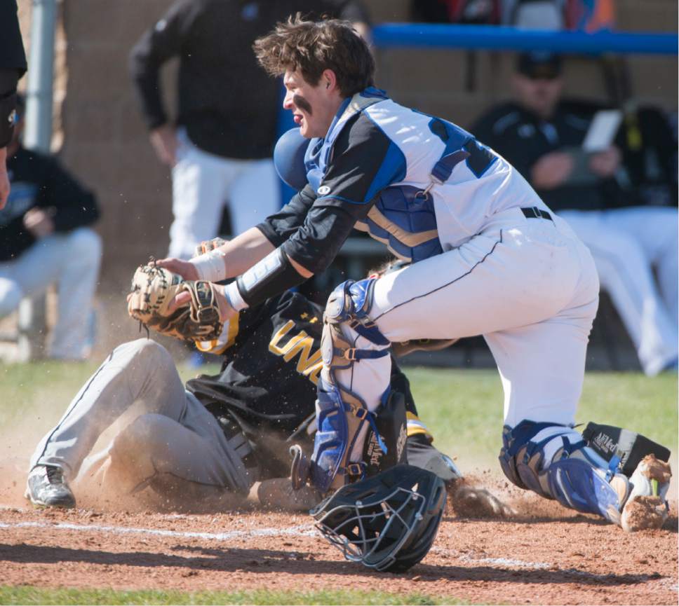 Rick Egan  |  The Salt Lake Tribune

Stansbury Catcher Kanyon Anderson(21)  tags out Parker Brinkerhoff (10) Union, at home plate, in prep baseball action, Union vs Stansbury, Monday, April 10, 2017.