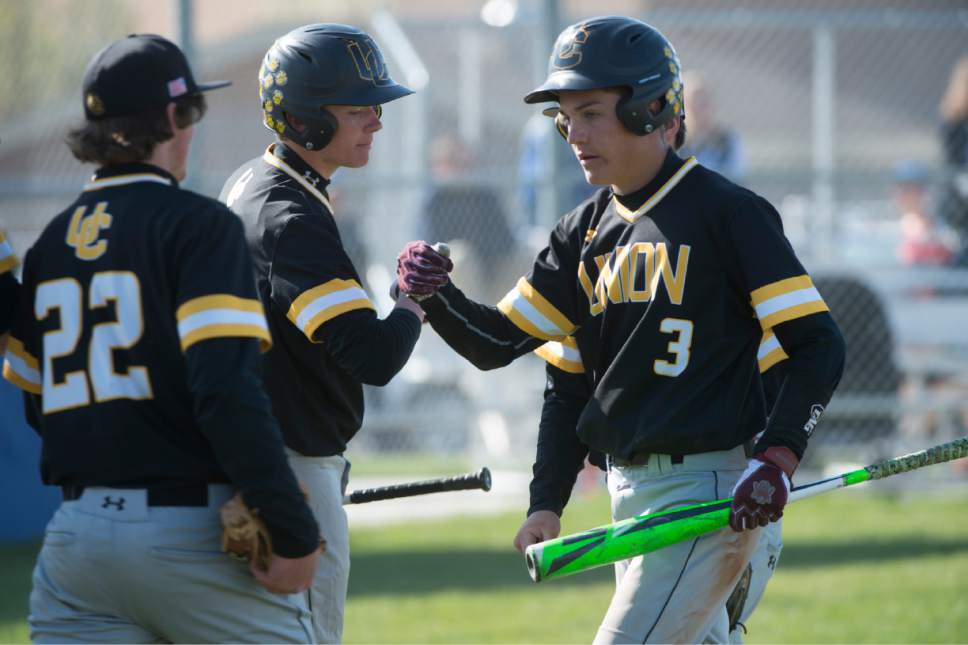 Rick Egan  |  The Salt Lake Tribune

Union teammates congratulates Gage Roberts (3) after Roberts scored the tying run in the sixth inning, in prep baseball action, Union vs Stansbury, Monday, April 10, 2017.