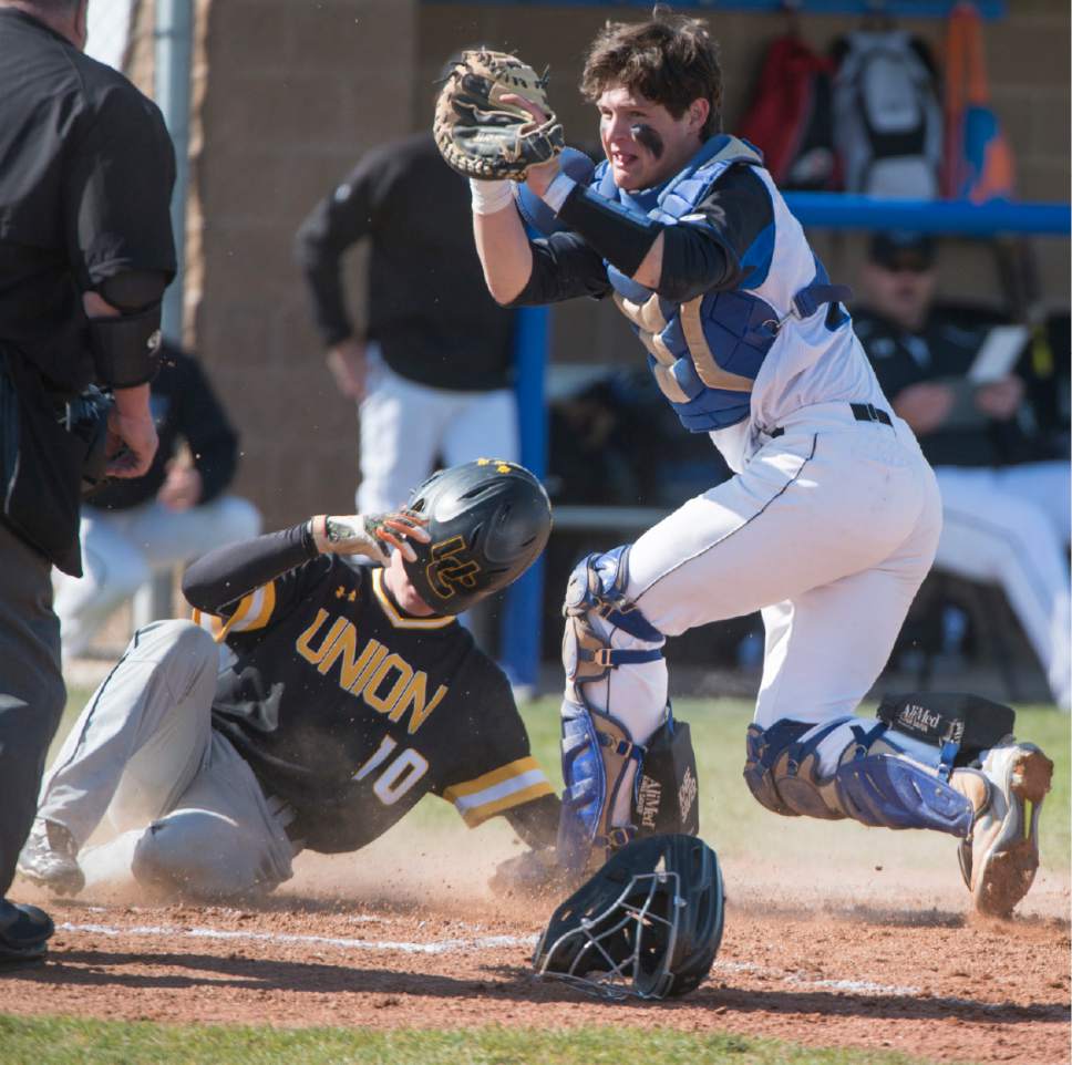 Rick Egan  |  The Salt Lake Tribune

Stansbury Catcher Kanyon Anderson(21)  tags out Parker Brinkerhoff (10) Union, at home plate, in prep baseball action, Union vs Stansbury, Monday, April 10, 2017.