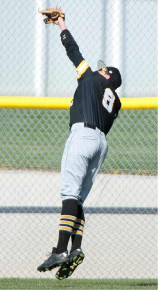 Rick Egan  |  The Salt Lake Tribune

Union center fielder Cole Bertoch (8) snags a ball in deep centerfield, in prep baseball action, Union vs Stansbury, Monday, April 10, 2017.