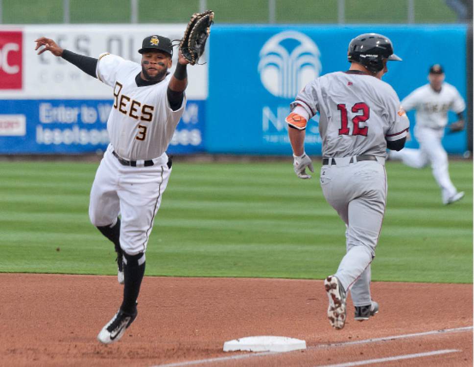 Michael Mangum  |  Special to the Tribune

Sacramento River Cats right fielder Austin Slater nabs a single following an off target throw to Salt Lake Bees first baseman Sherman Johnson (3) during their game at Smith's Ballpark on Tuesday, April 11, 2017.