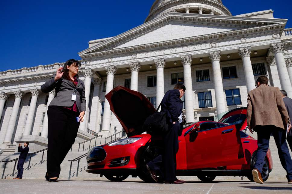 Francisco Kjolseth  |  The Salt Lake Tribune 
Rep. Kim Coleman, R-West Jordan, left, tours a Tesla Model S in front of the Utah Capitol on Tuesday, March, 10, 2015, the day after the House of Representatives rejected her legislation HB394 to eliminate the current prohibition against manufacturers owning a dealership in the state. Currently they have to go through third-party franchises.