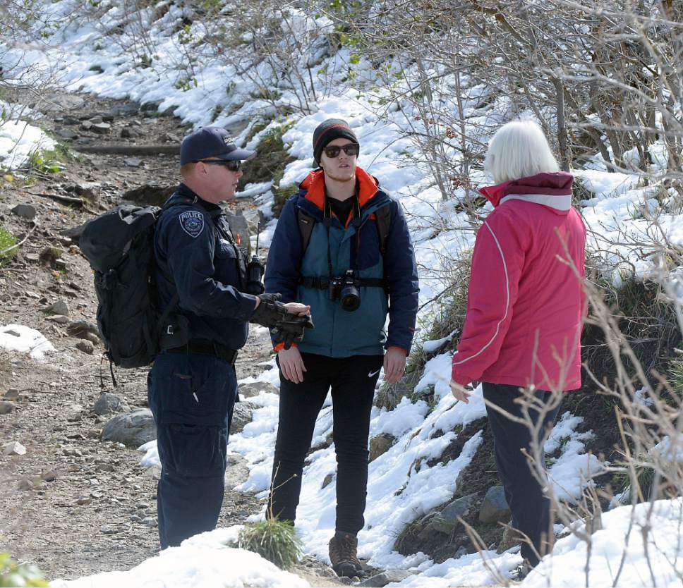 Al Hartmann  |  The Salt Lake Tribune
Mother and brother of Benjamin Kritze, 28,  join in the resumed search with Unified Police canyon patrol officers in Ferguson Canyon Monday April 10.  Kritze has been missing since Thursday on a solo hike in the mountains above Cottonwood Heights.