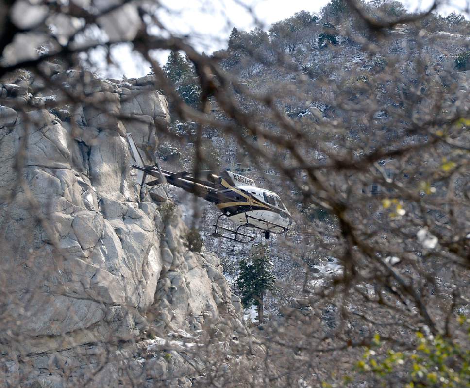 Al Hartmann  |  The Salt Lake Tribune
Utah Department of Public Safety helicopter passes slowly over cliffs in Ferguson Canyon Monday April 10 in the resumed search for a Saratoga Springs man Benjamin Kritzer, 28 who has been missing since Thursday on a solo hike in the mountains above Cottonwood Heights.