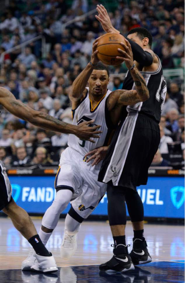 Steve Griffin  |  The Salt Lake Tribune

Utah Jazz guard George Hill (3) drives past San Antonio Spurs guard Danny Green (14) during the final game of the 2017 season at Vivint Smart Home Arena in Salt Lake City Wednesday April 12, 2017.
