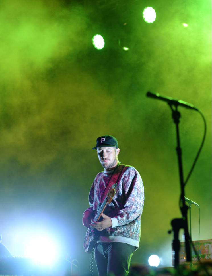Steve Griffin  |  The Salt Lake Tribune

Colored lights illuminate the stage as Zach Carothers, of Portugal. The Man, sings as the band co-headlined with Grouplove during a sold-out show at the Red Butte Garden Amphitheatre in Salt Lake City, Tuesday, August 19, 2014.