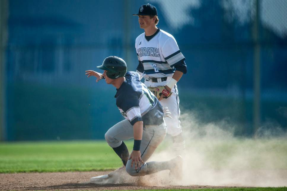 Chris Detrick  |  The Salt Lake Tribune
Timpanogos' Tyler Cornish (11) slides safely into second base past Corner Canyon's Colson Anderson (6) during the game at Corner Canyon High School Thursday, April 13, 2017.  Timpanogos defeated Corner Canyon 4-2.
