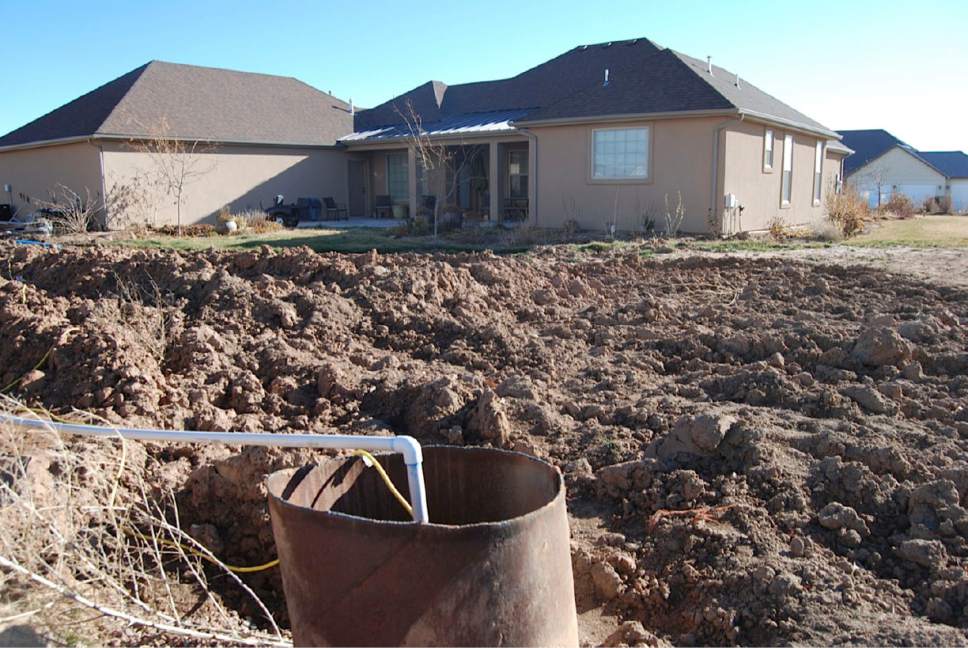 Brian Maffly  |  The Salt Lake Tribune

Dan Robinson's backyard the Stonegate subdivision west of Roosevelt has been destroyed in the homeowner's failed effort to salvage his septic system. The stench and mess forced Robinson to move his family out while Duchesne County figures out a solution to this area's drainage problems which have turned parts of this neighborhood into "an open sewer," says Robinson, a Roosevelt dentist. The county could impose a moratorium on residential construction in its unincorporated Hancock Cove until this subdivided agricultural area can be sewered.