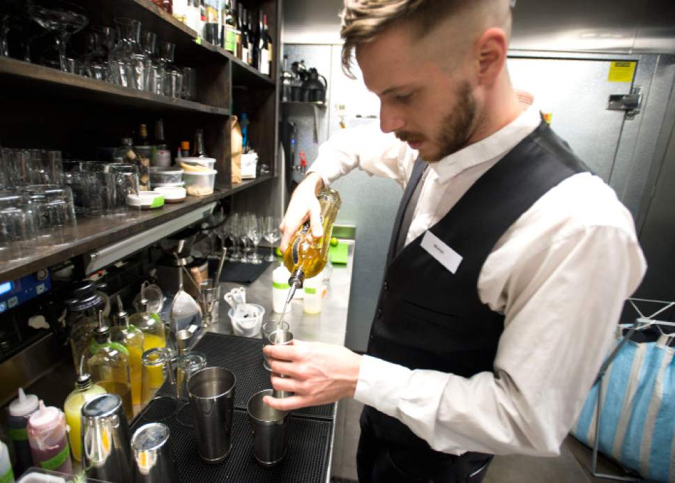 Steve Griffin | The Salt Lake Tribune


Table X bartender Warren Beecroft mixes a new drink called "The Last Toddy" at the new restaurant in Salt Lake City, Wednesday, Dec. 14, 2016. The restaurant has created a twist on the "hot toddy," creating the drink with Beehive Jack Rabbit Gin (made in Utah), green chartreuse, St. Germain (elderflower liquor), lime, rosemary and juniper.