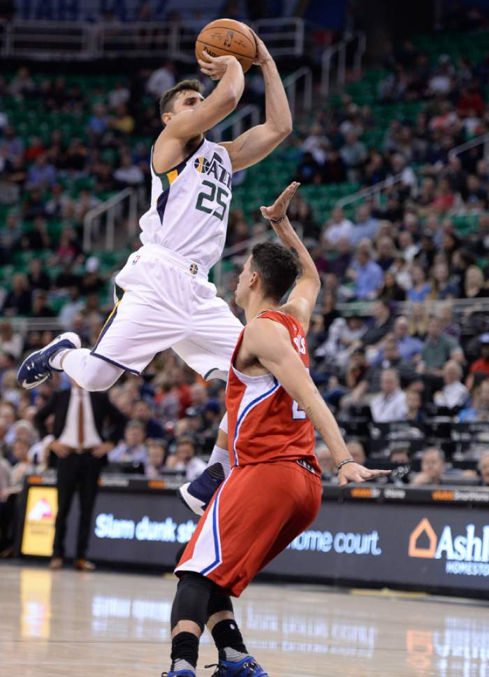 Francisco Kjolseth | The Salt Lake Tribune
Utah Jazz guard Raul Neto (25) soars over Los Angeles Clippers guard Austin Rivers (25) on his way to the basket in game action at Vivint Smart Home Arena on Monday, Oct. 17, 2016, with a Jazz win of 104-78.