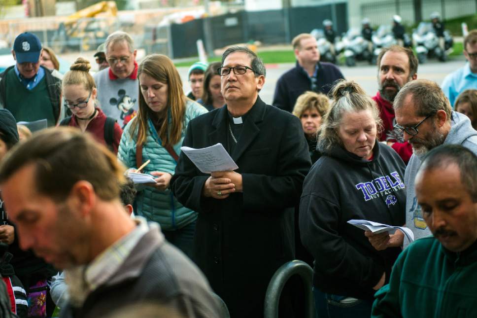 Chris Detrick  |  The Salt Lake Tribune
The Most Rev. Oscar Solis, Bishop, The Diocese of Salt Lake City, listens at the Crossroads Urban Center during the annual Good Friday Procession of the Cross Saturday, April 15, 2017.  Since 1983, the Salt Lake Council of Churches has sponsored this annual procession, which is similar to the tradition of the "Via Dolorosa" (Way of Suffering), where pilgrims to Jerusalem follow the path Jesus took to the cross.