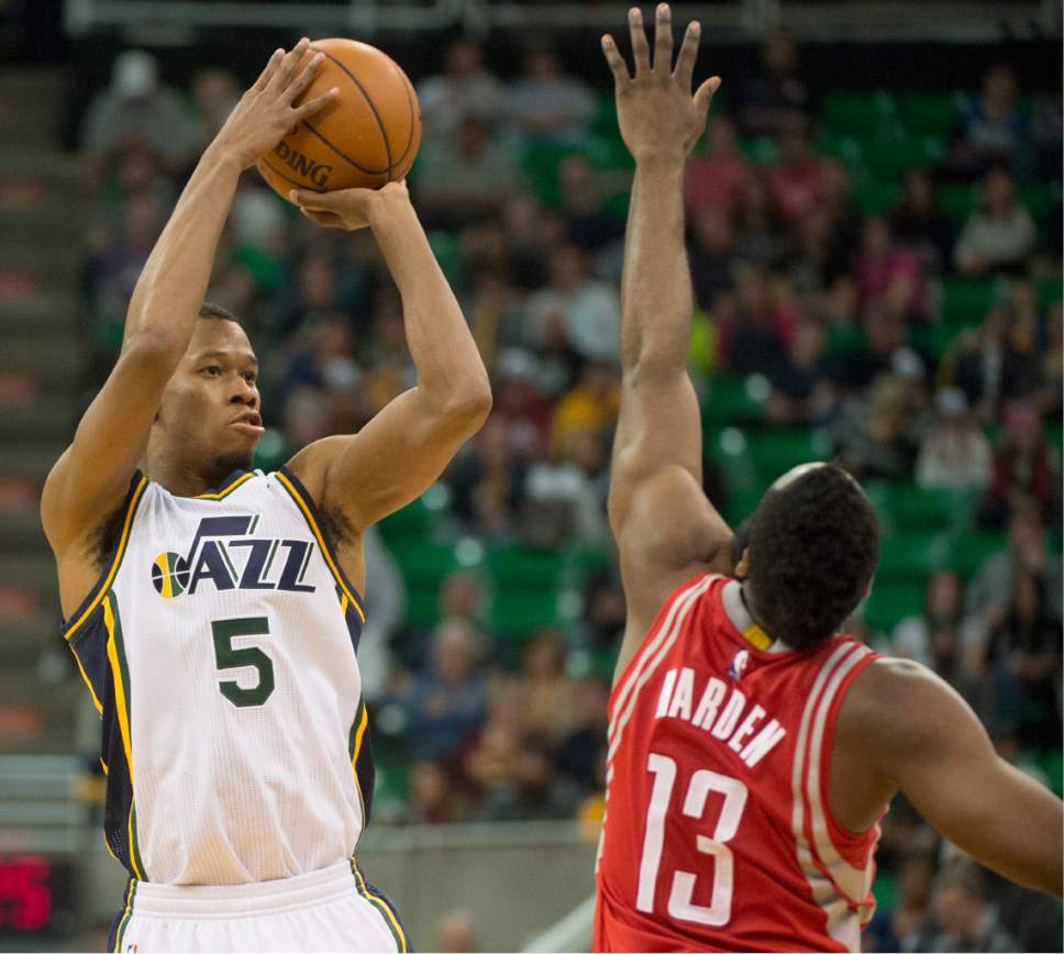 Rick Egan  |  The Salt Lake Tribune

Utah Jazz guard Rodney Hood (5) shoots overHouston Rockets guard James Harden (13) in NBA action, The Utah Jazz vs. The Houston Rockets, in Salt Lake City, Monday, January 4, 2016.