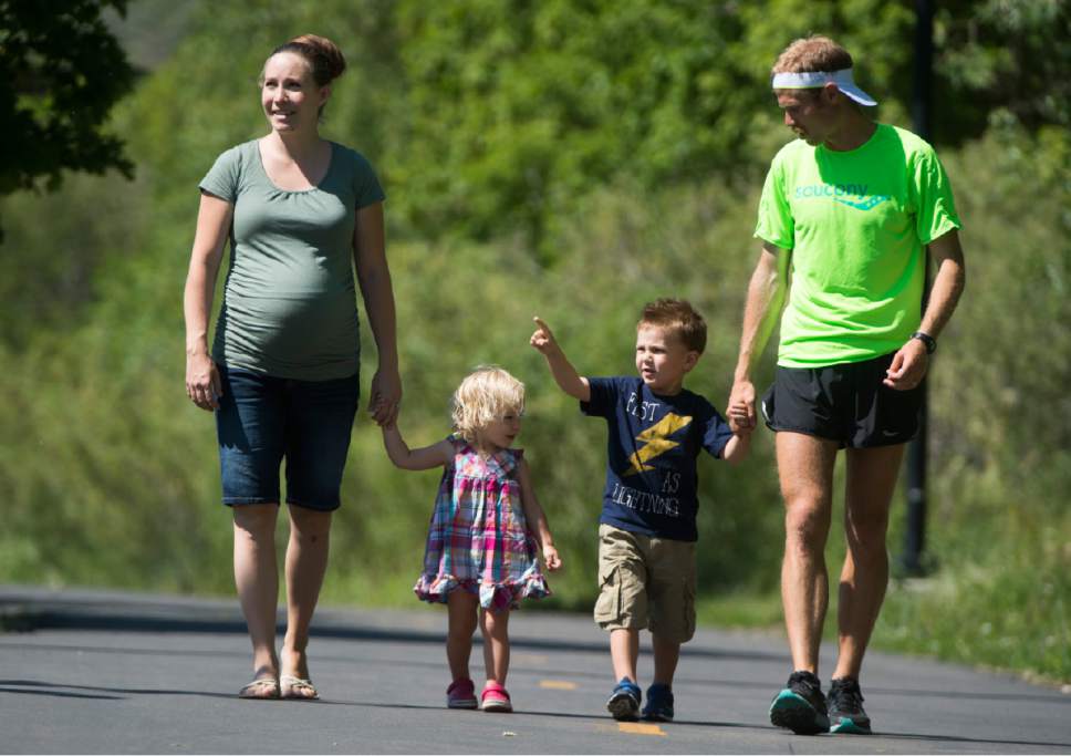 Rick Egan  |  The Salt Lake Tribune

Erica Ward walks with 2-year-old Ellie, 4-year-old Paul, and her husband, 
Jared Ward, a former BYU distance runner. The family recently moved to Park City so Ward can train at altitude for the this summer's Olympic Games in Rio de Janeiro. Tuesday, June 21, 2016.